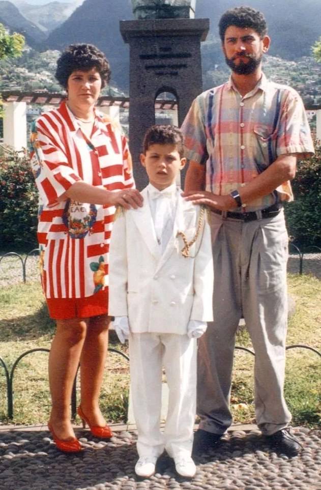 Cristiano Ronaldo with his parents at the age of 10. He has admitted to never really knowing his father