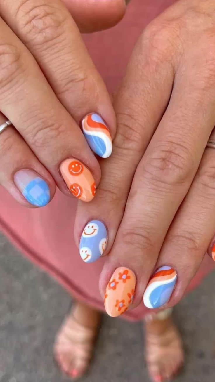 Retro nail art designs with flowers and smiley faces