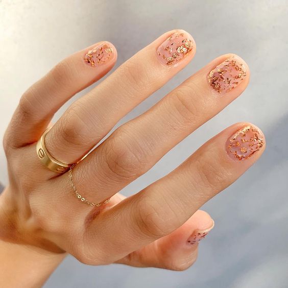 Short natural clear nails with gold foil accents