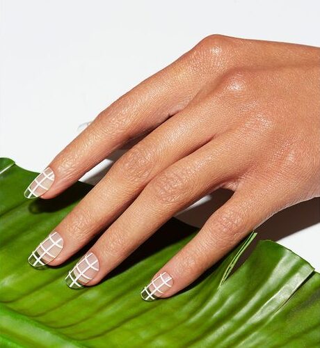 Medium round clear nails with white abstract nail art