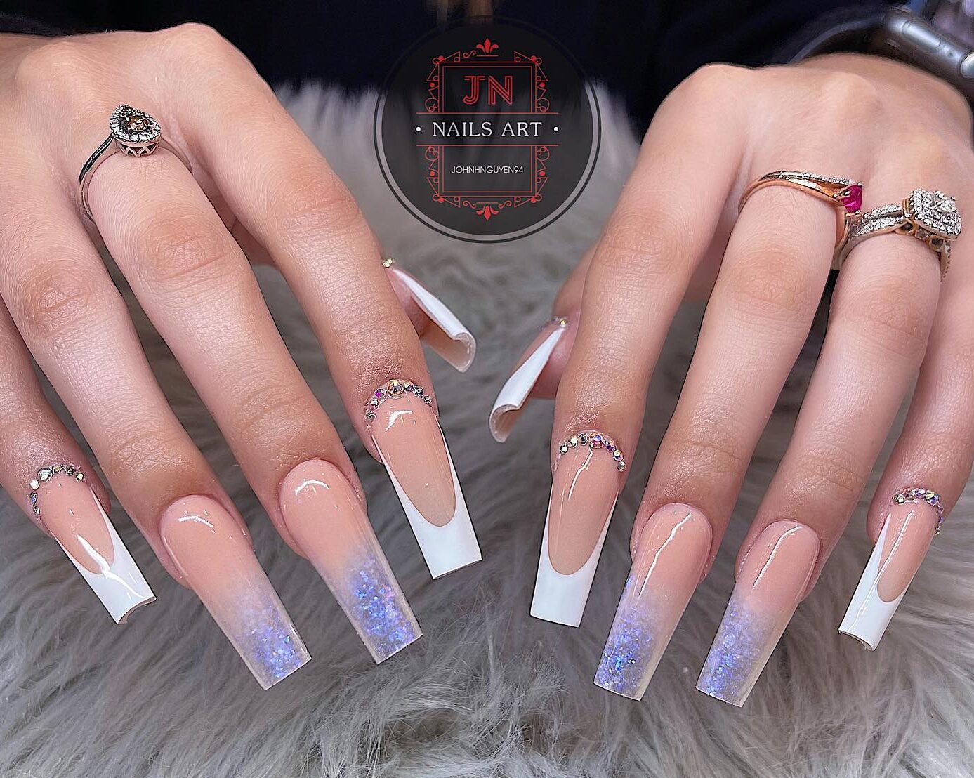 Nude to clear ombre effect with rhinestones, glitters, and french tips on super long square nails