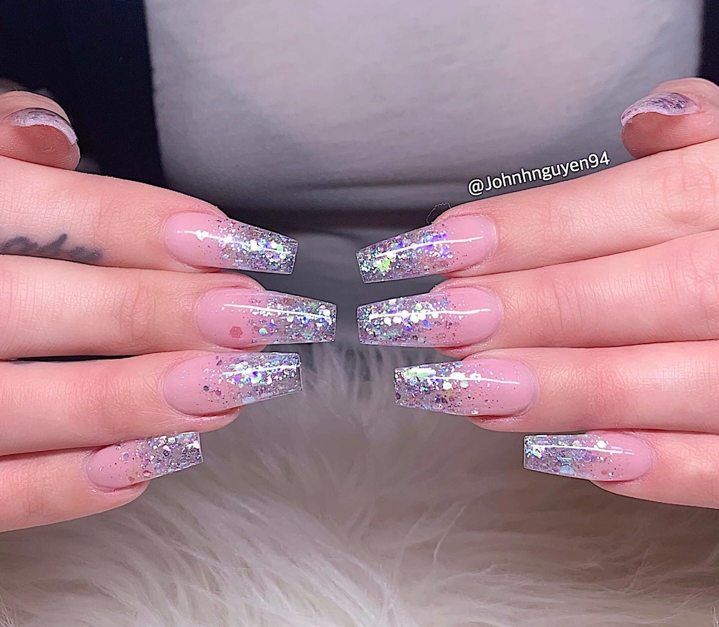 Long tapered square clear nails with sparkling glitters