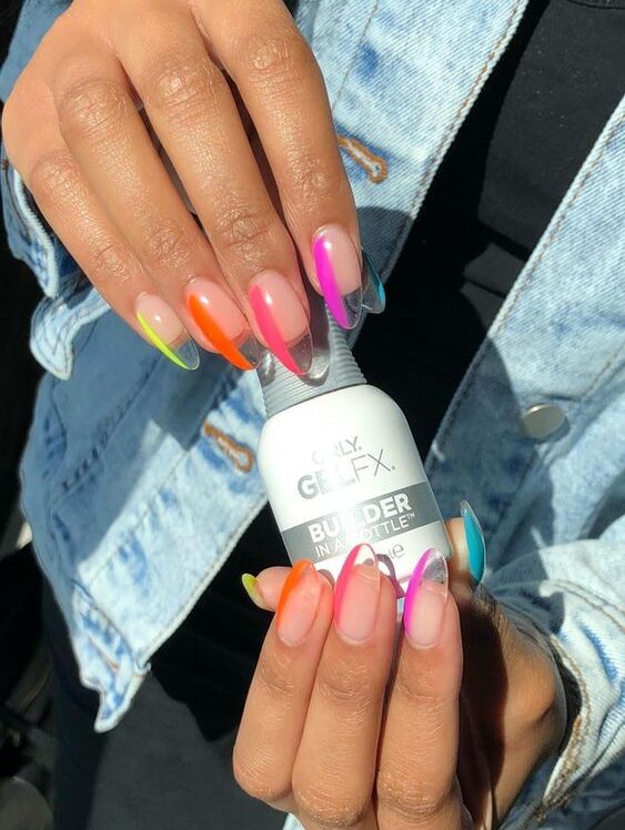 Long almond shaped clear nails with colorful accents nail art