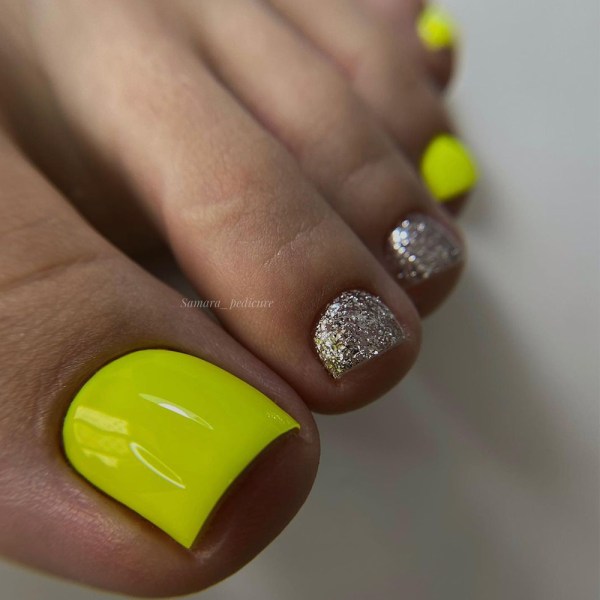 Yellow Pedicure with Two Glitter Nails