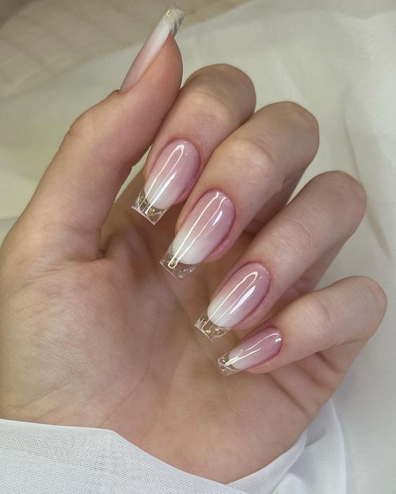 Long square shaped nude ombre nails with clear French tips