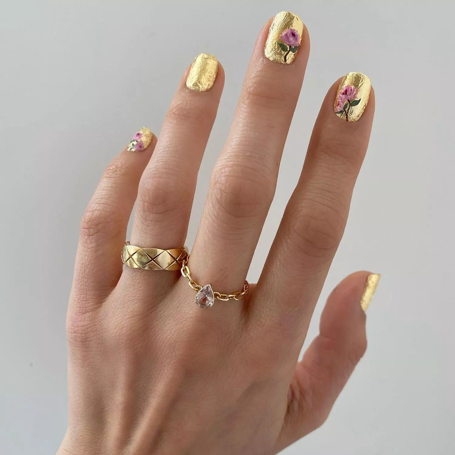 Gold leaf paper manicure with rose designs