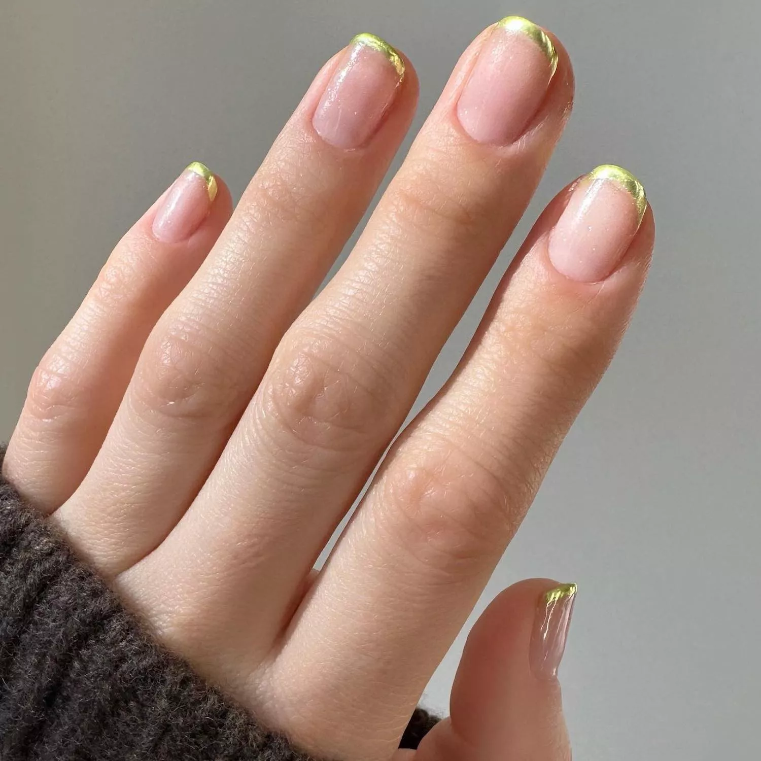 Manicure with metallic gold French tips