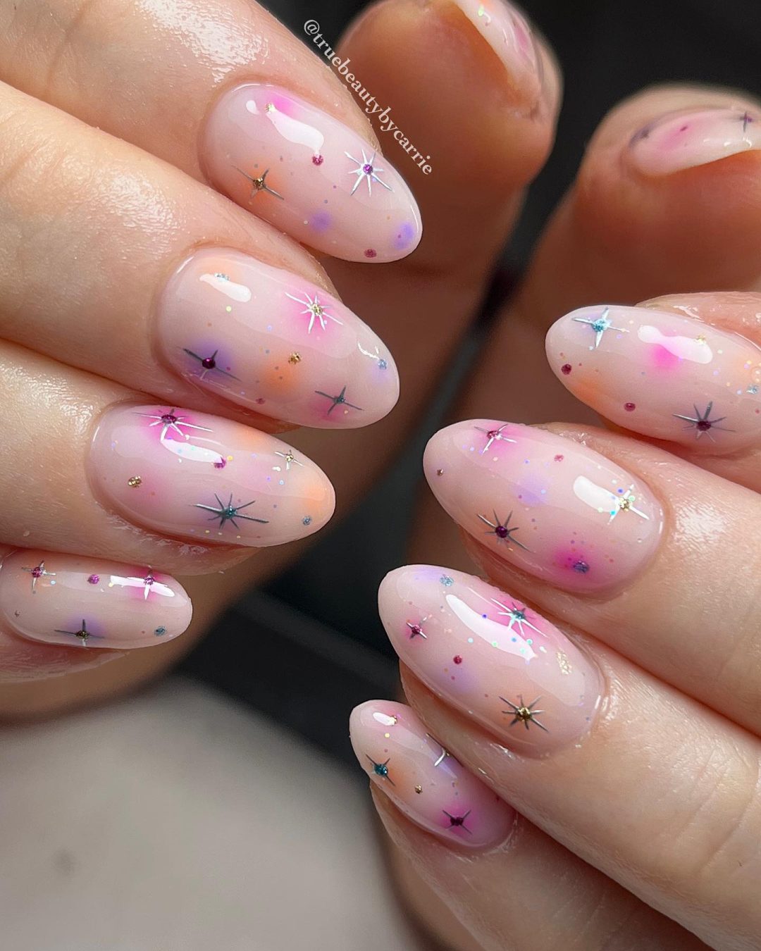 Pastel pink star nails.