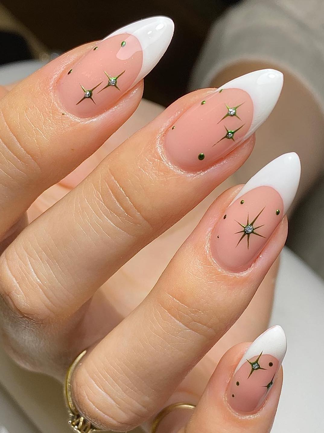 White French tip nails with star details.