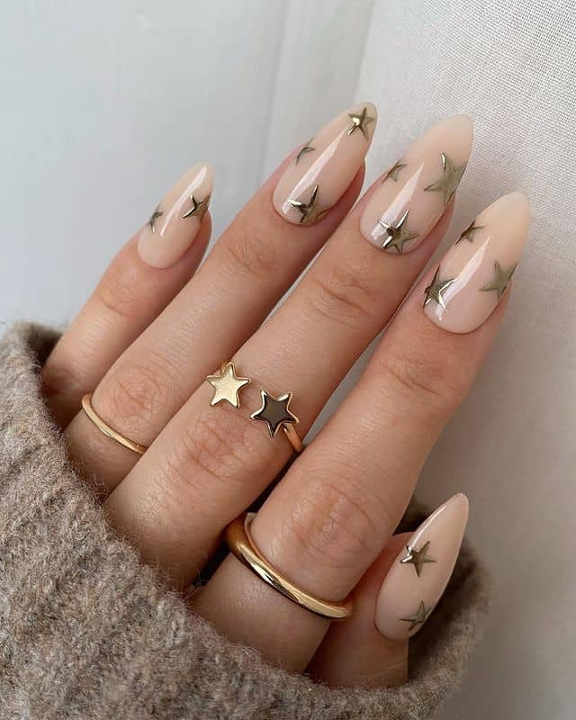 Cute nude almond nails with star decals