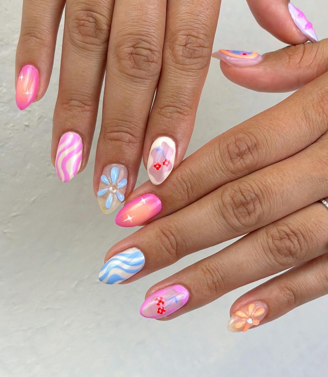 Cute colorful mix and match nails with stripes for summer.