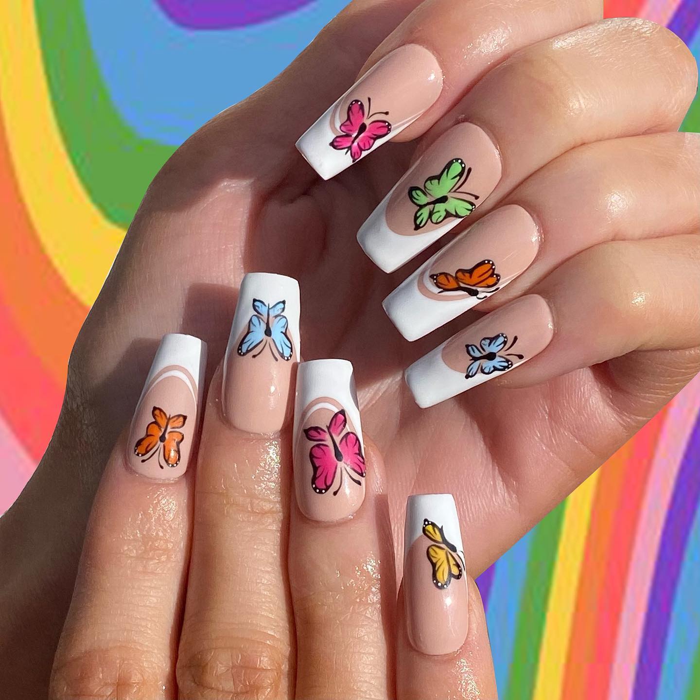 Isn't it great that two nails create one butterfly design? Just look how cute it is. This nail design is super cool for sunny days.