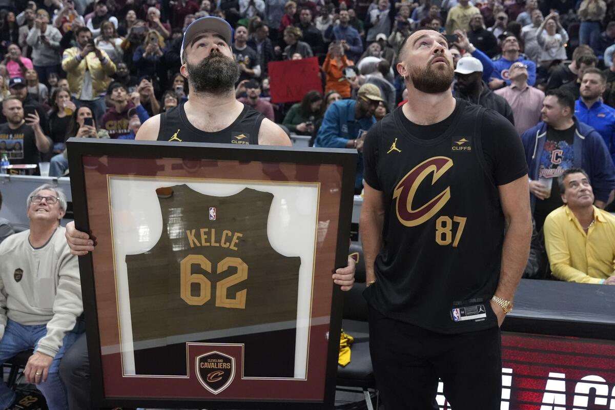 Travis and Jason Kelce attend bobblehead giveaway. Cavaliers give Jason a framed  No. 62 jersey - The San Diego Union-Tribune