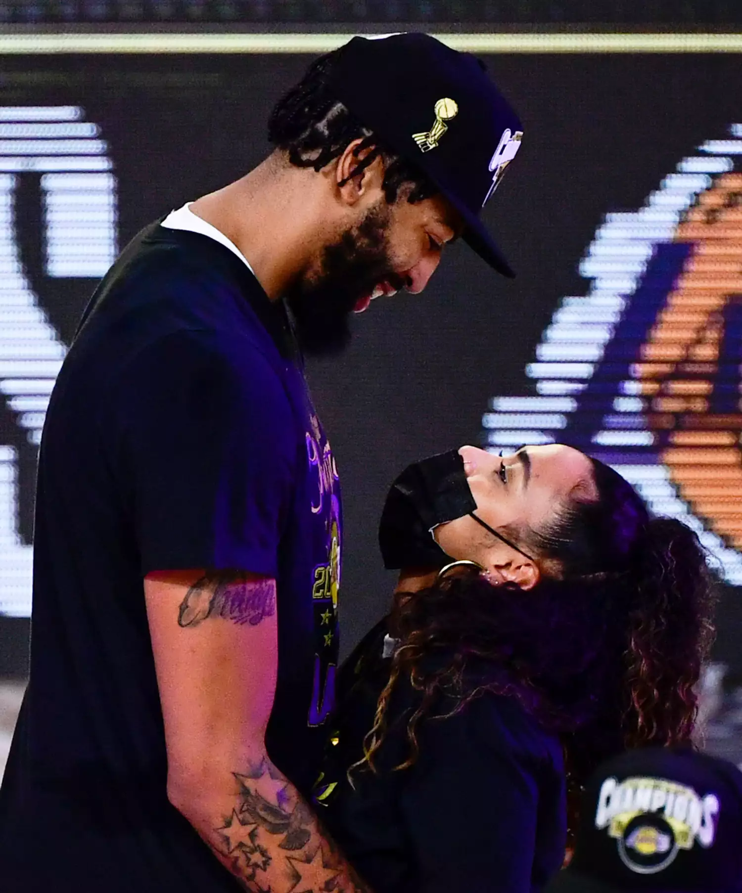 Anthony Davis #3 of the Los Angeles Lakers hugs his girlfriend after winning the 2020 NBA Championship