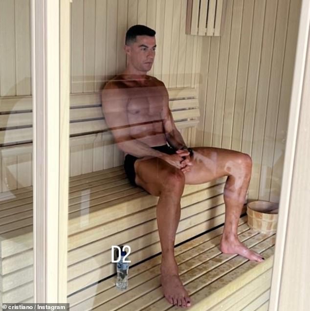 Cristiano Ronaldo is seen with black painted toenails as he enjoys some downtime in the sauna
