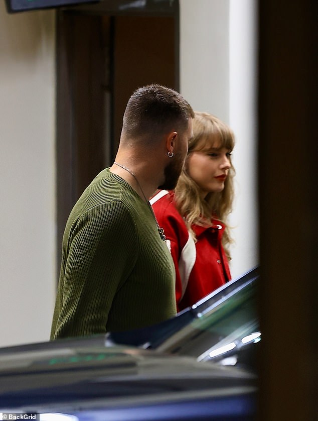 For their evening out, Swift sported a red varsity jacket with white racing stripes down the sleeves over a dark top and denim skirt