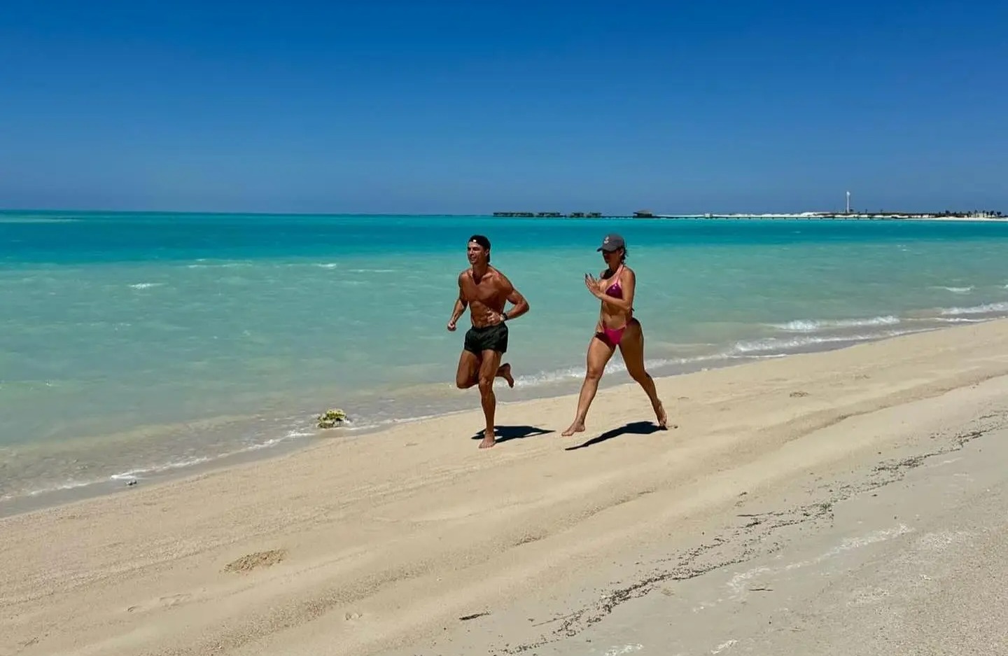 CR7 and and Georgina Rodriguez build up a sweat as they worked out on the beach