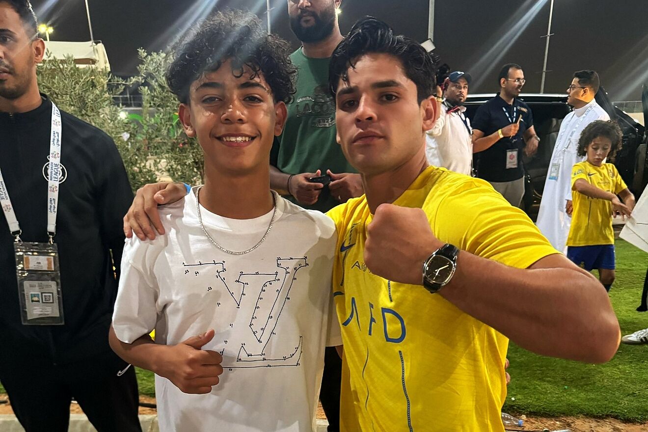 Ryan Garcia with Cristiano Ronaldo Jr. outside an Al Nassr game.
