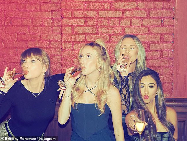 Taylor is pictured with Brittany,Lyndsay Bell and Paige Buechele, all of whom are partners of Chief's players, back in November