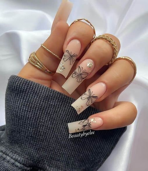 Long square acrylic nails with butterfly abstract nail design