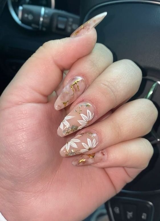 Clear almond shape acrylic nails with white flowers and gold foil