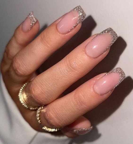Shimmering French tips on medium square nails