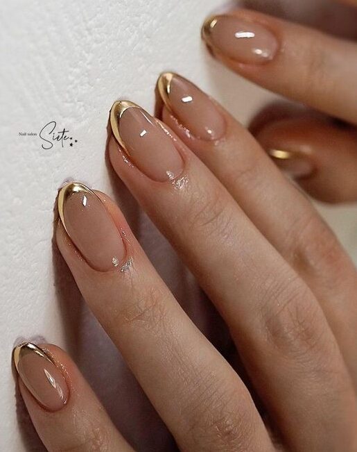 Shining gold French tips on short clear round nails