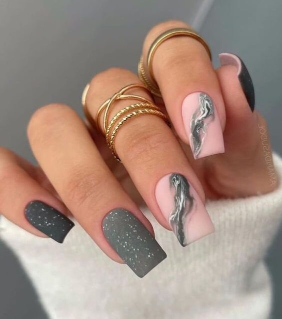 Matte grey nail polish with grey marble nail art on medium square nails