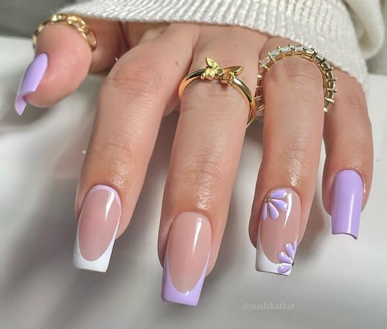 Lavender and white French tips with lavender flowers on medium square nails