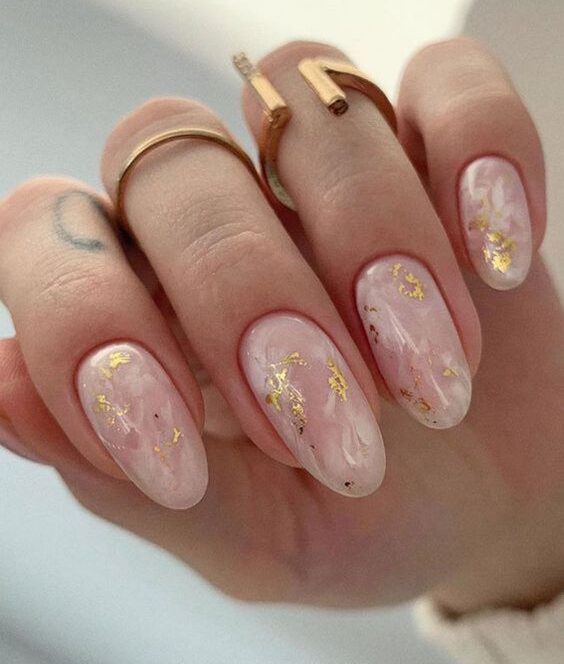 Clear round nails with smokey marble nail art and gold foil