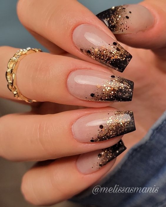 Glossy clear coffin shape nails with ombre style gold and black glitters