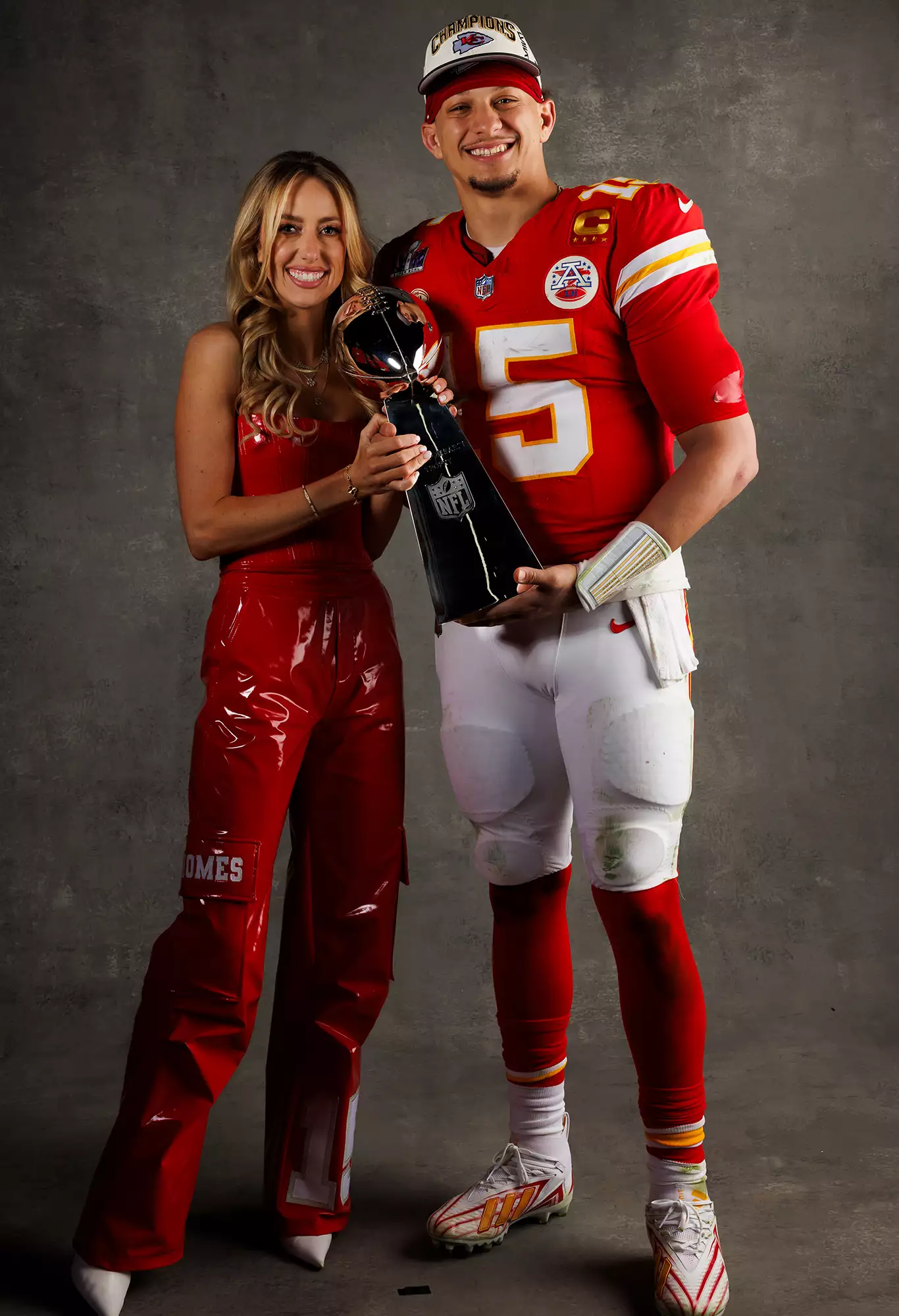 Patrick Mahomes and Brittany Mahomes pose for a portrait with the Vince Lombardi Trophy after Super Bowl LVIII against the San Francisco 49ers at Allegiant Stadium on February 11, 2024.