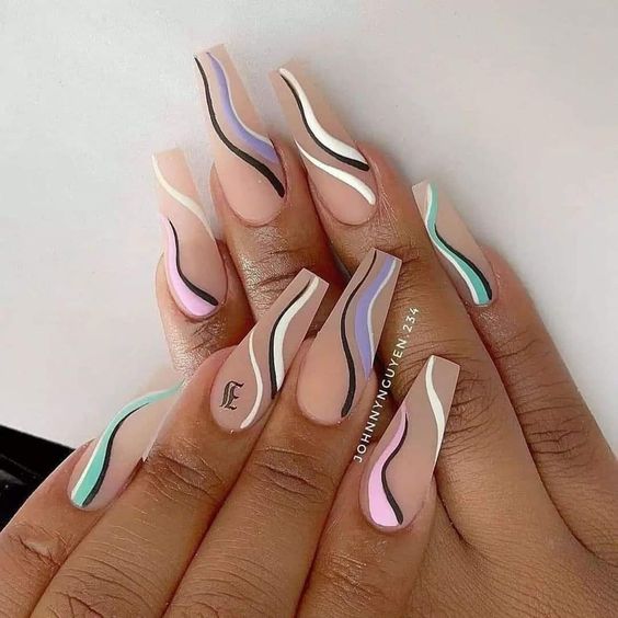 Clear long acrylic nail in coffin shape with multicolored swirls