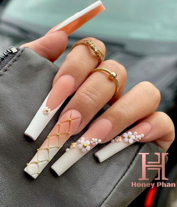 White ombre nail art in matte finish with 3D flowers on super long square nails