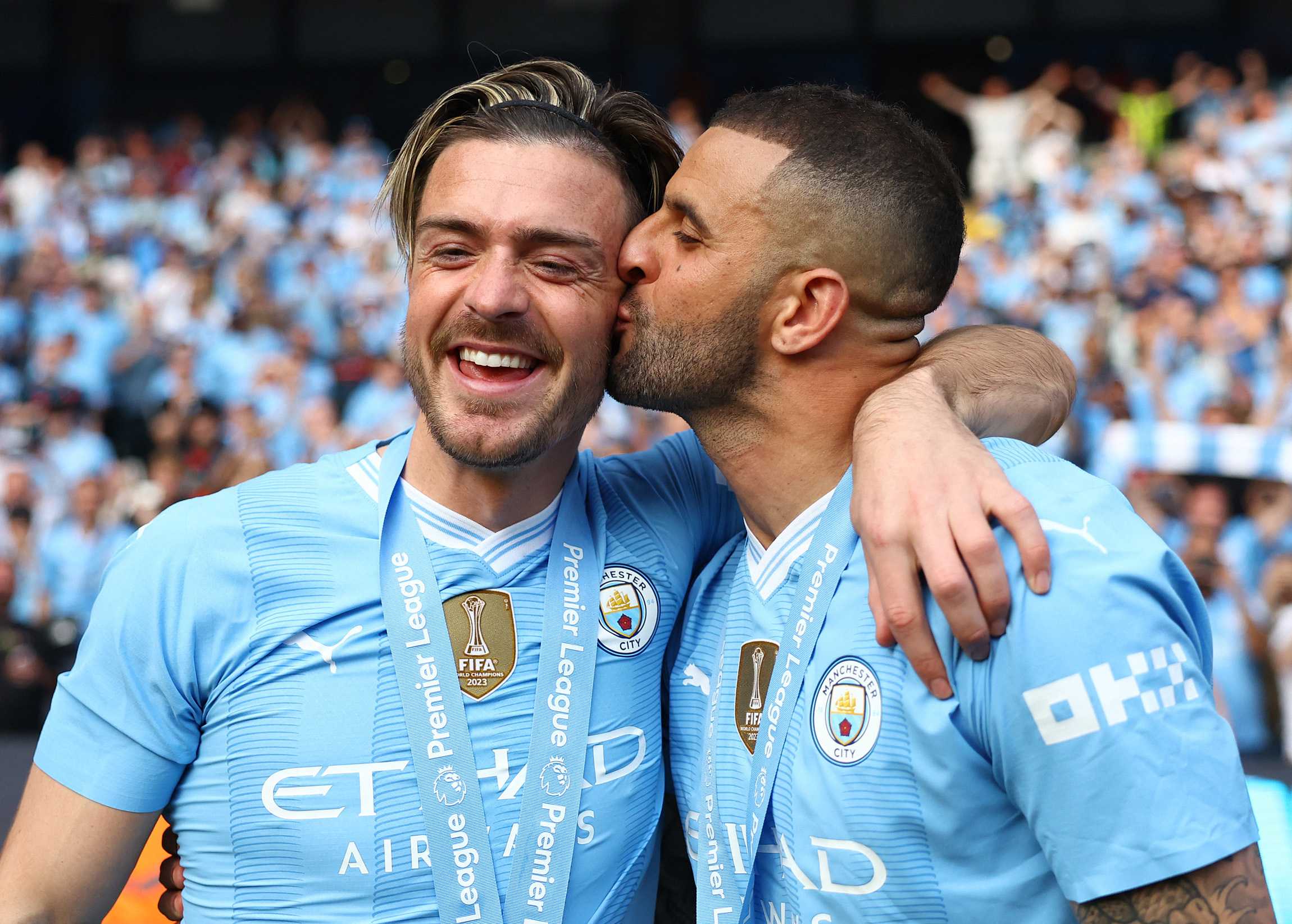 Walker kisses a jubilant Grealish on the cheek amid the celebrations