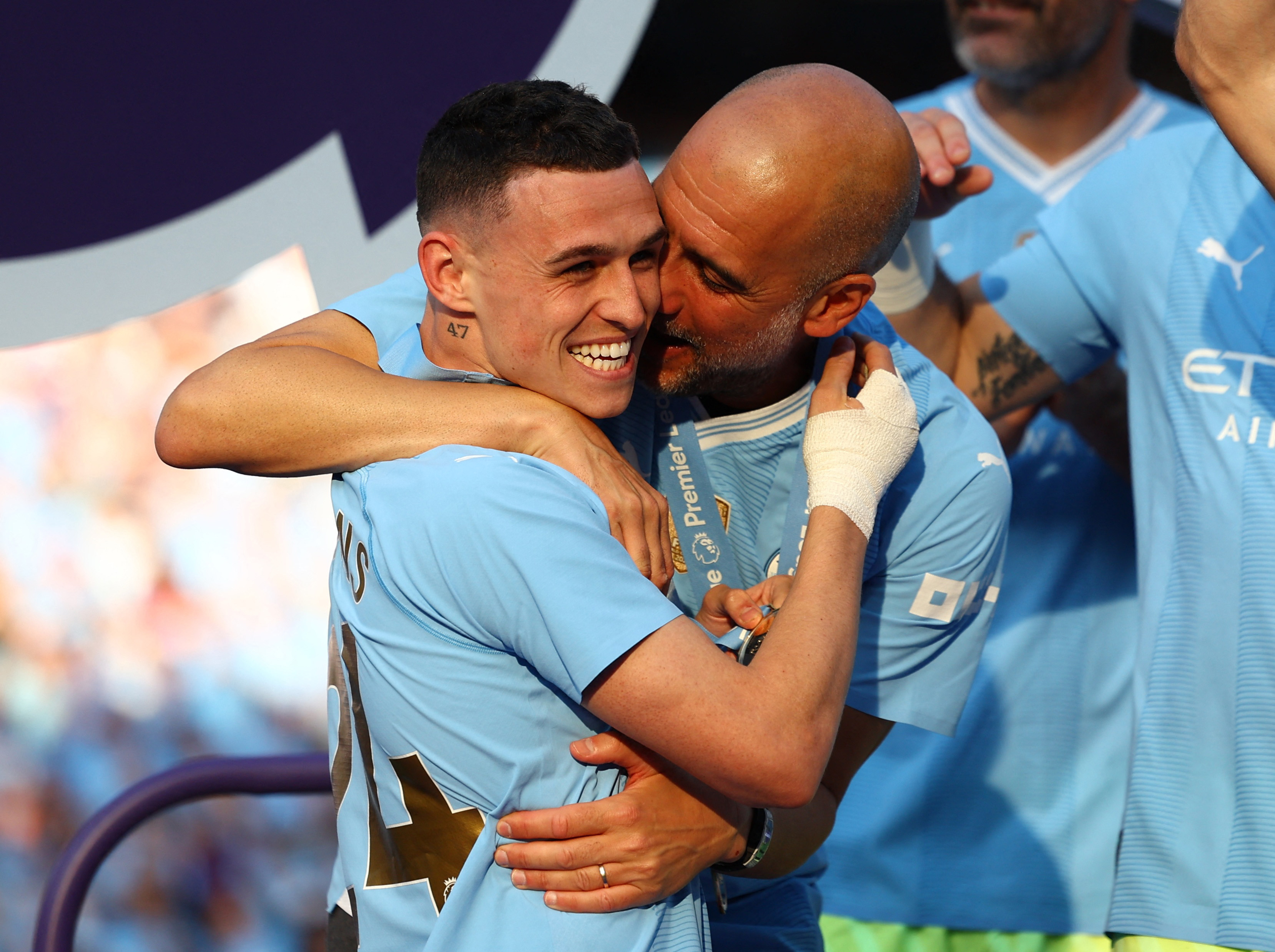 Pep Guardiola shares a moment with Phil Foden