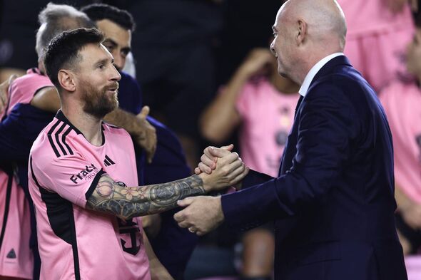 Lionel Messi #10 of Inter Miami shakes the hand of FIFA President Gianni Infantino